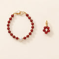Der Fluss des Feuers: Nanhong-Rotachat-Perlenarmband und florales Ohrring-Set