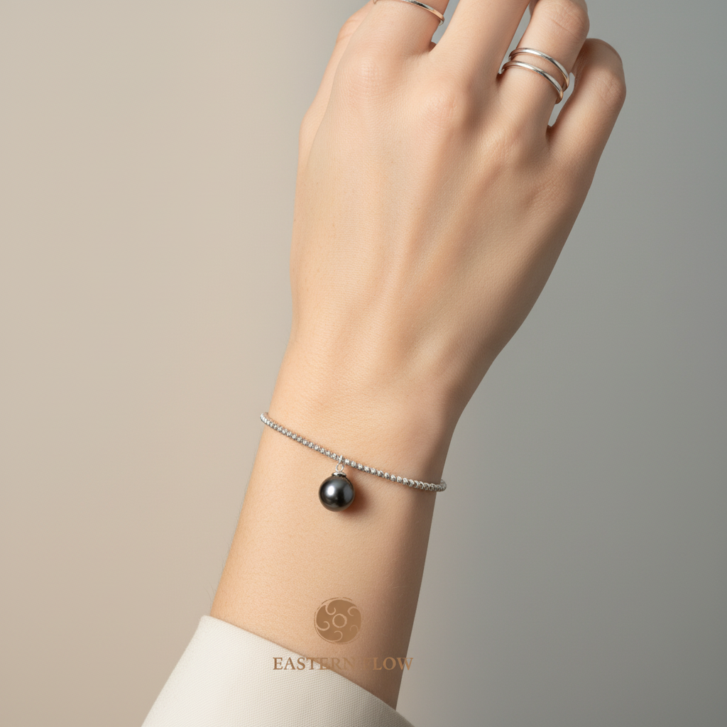 Tahitian pearl bangle wrist shot, Water Element energy for intuitive empaths - Eastern Flow